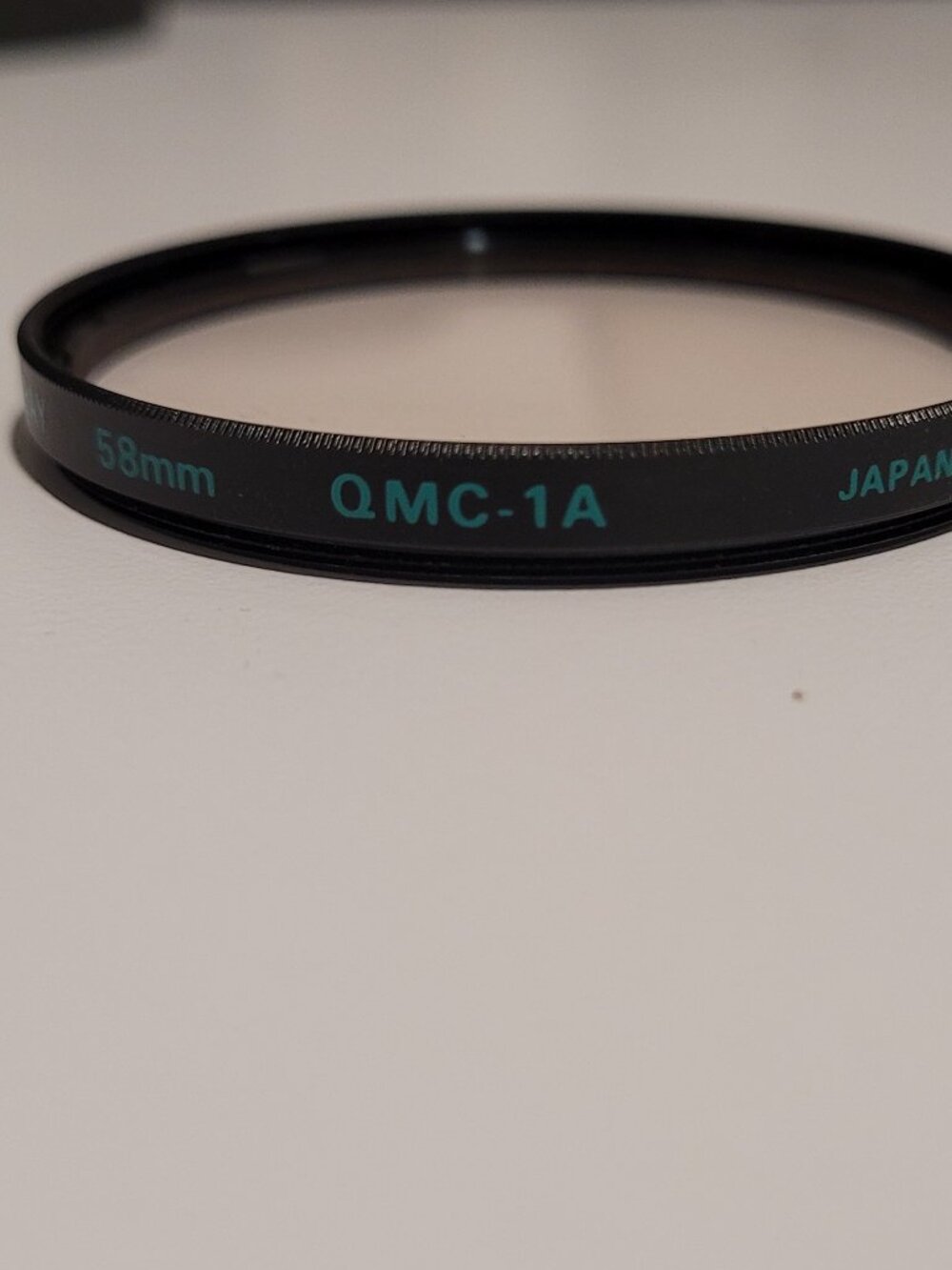Quantaray 58mm OMC Multi-Coated camera lens filter skylight correction